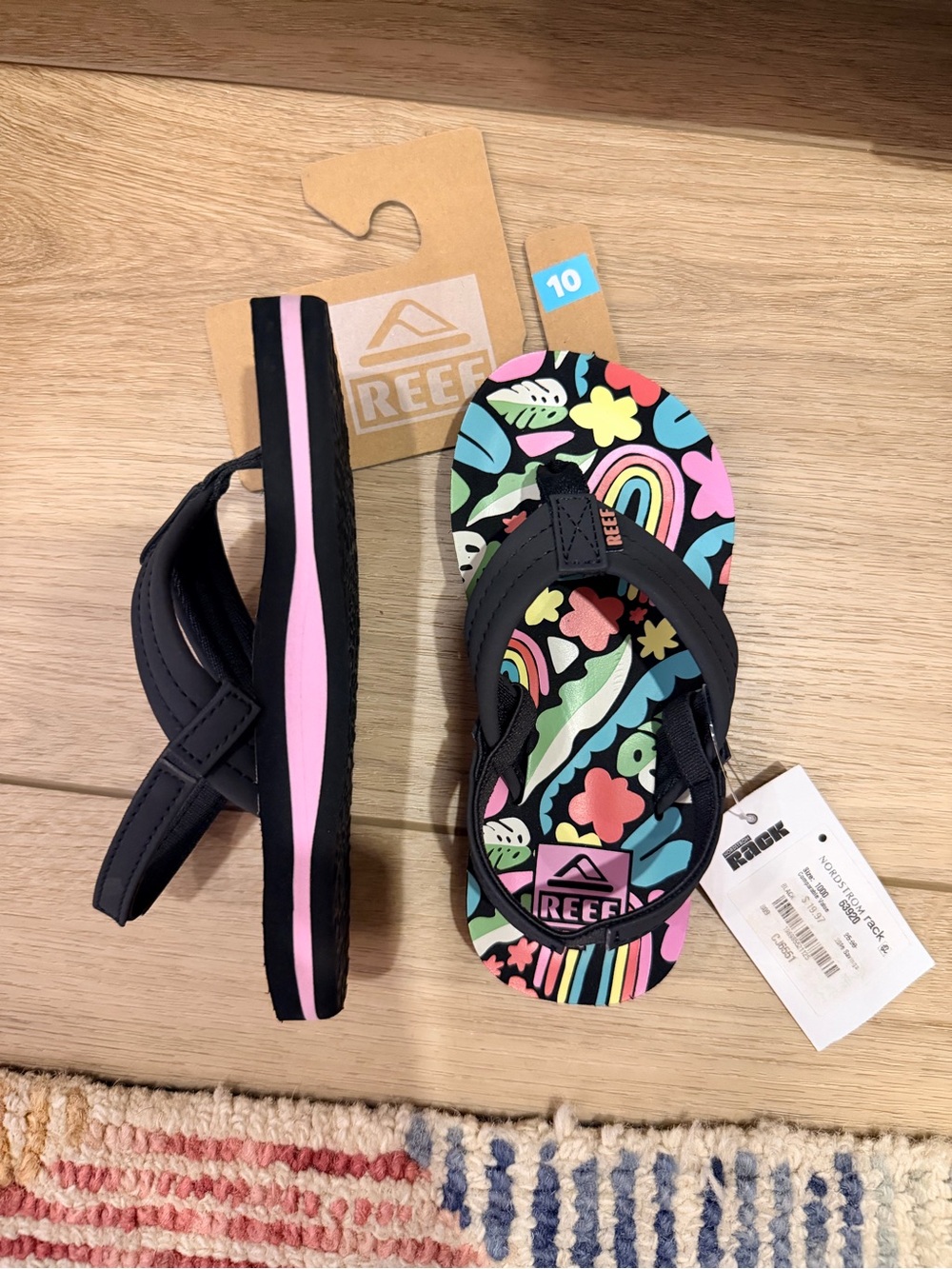 Reef Kids Black Flip Flops with Pink and Multicolor Floral Rainbow Print